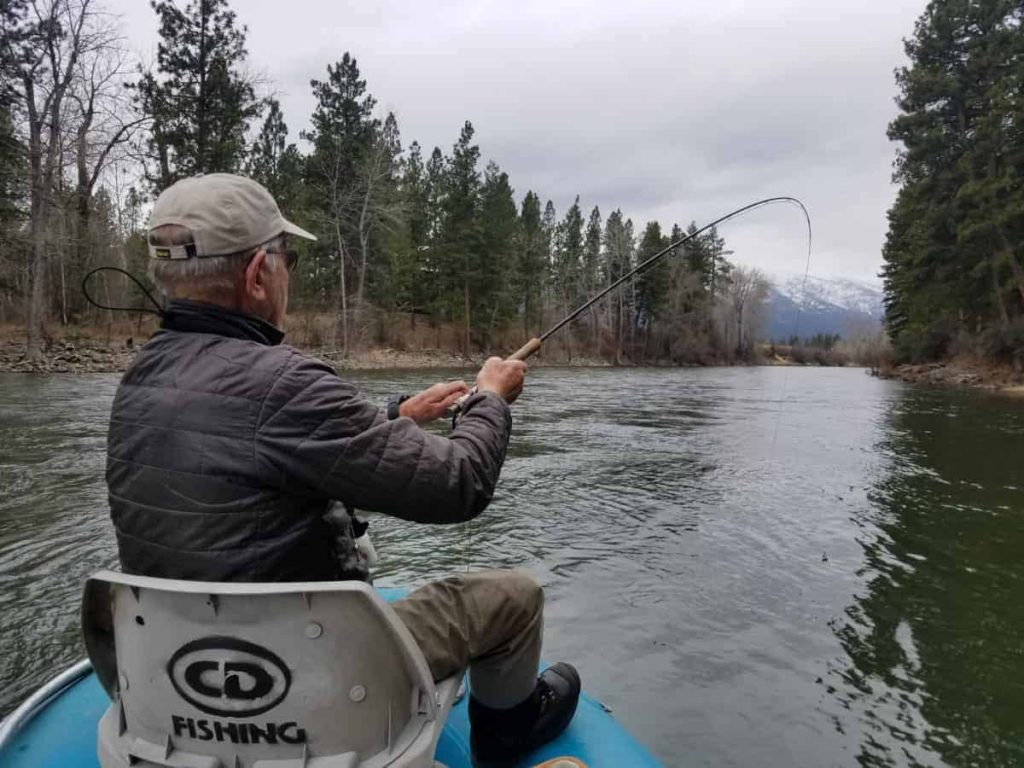 Client in Montana Landing a Trout
